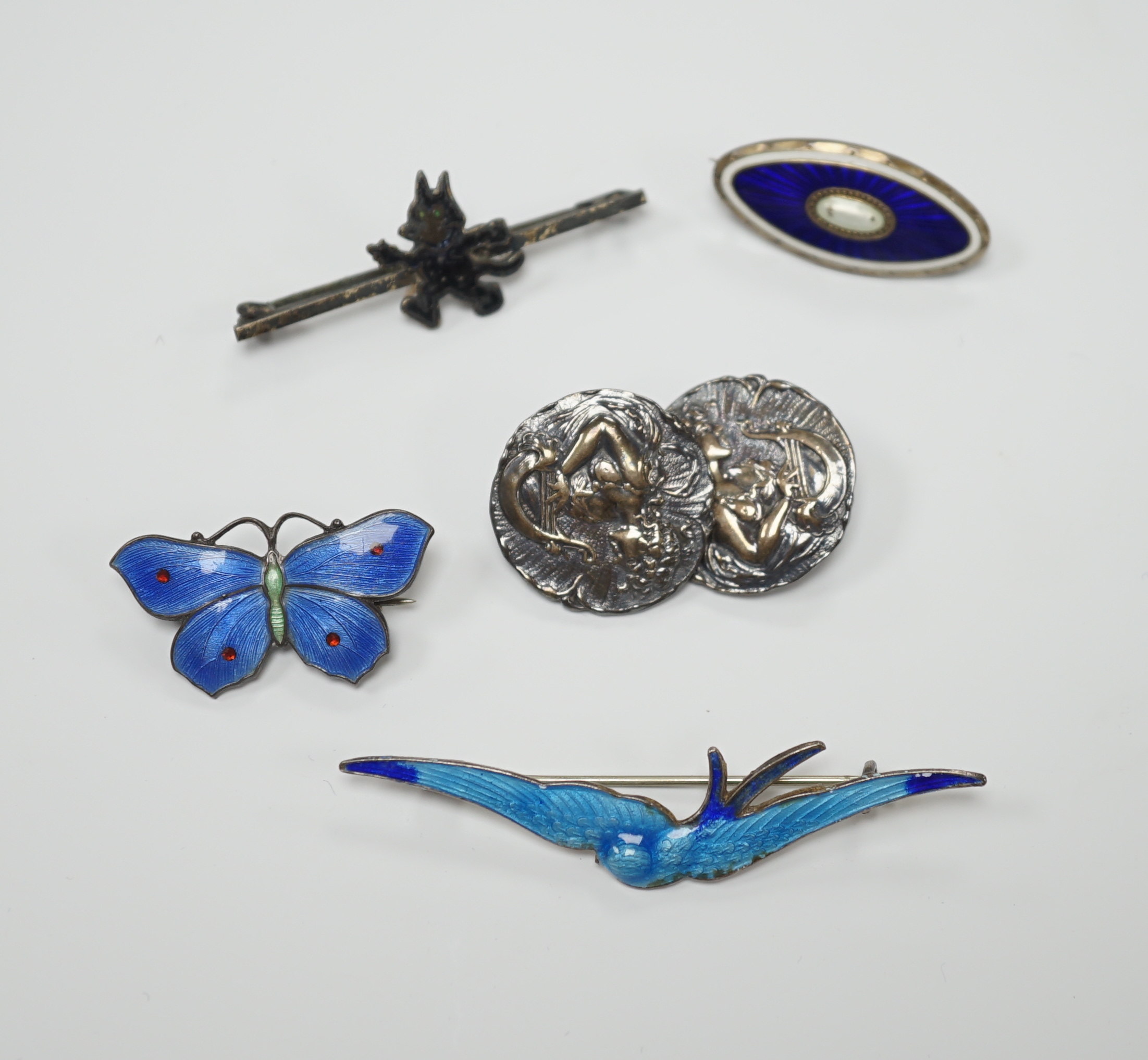 A Norwegian 925S and two colour enamel oval brooch, 28mm, a sterling and three colour enamel butterfly brooch, a white metal (stamped silver) and enamel swallow brooch, a pair of Edwardian Art Nouveau silver buttons and